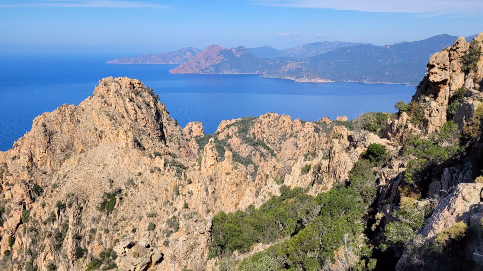 Admire the Dramatic Red Cliffs of the Calanques de Piana