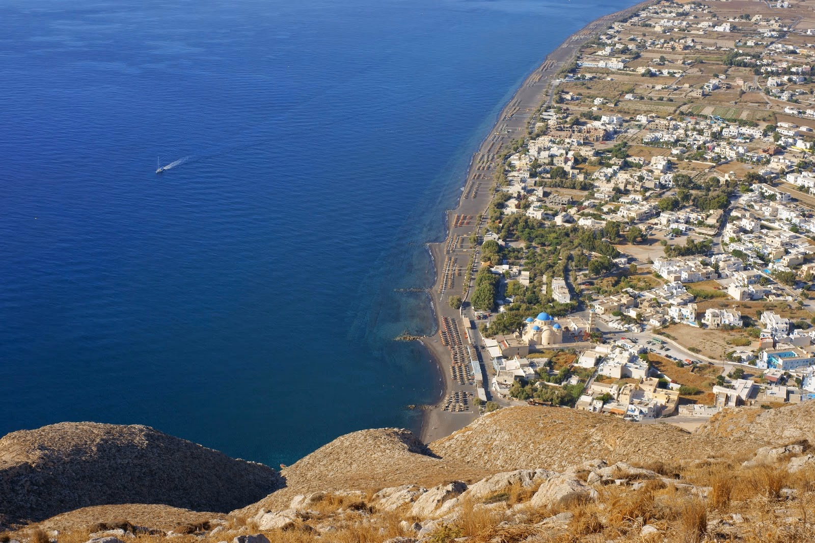Perissa: Black Sand Beach and Coastal Charm
